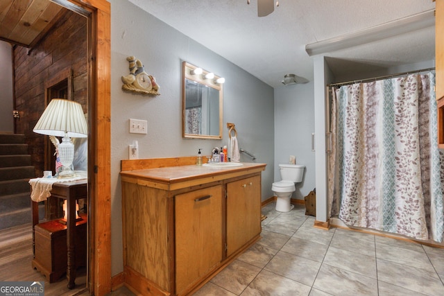 bathroom featuring vanity, tile patterned flooring, ceiling fan, toilet, and a textured ceiling