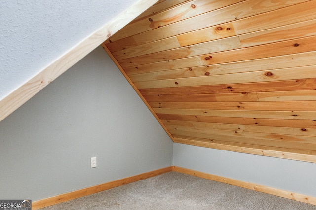 additional living space with carpet and vaulted ceiling