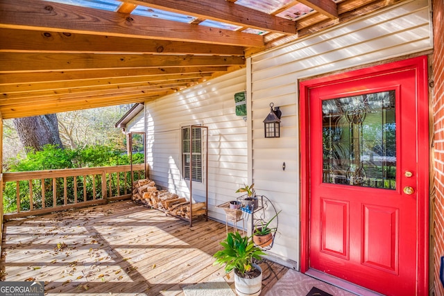 doorway to property featuring a wooden deck