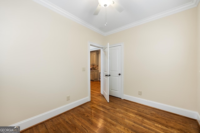 unfurnished room featuring ceiling fan, ornamental molding, and dark hardwood / wood-style floors