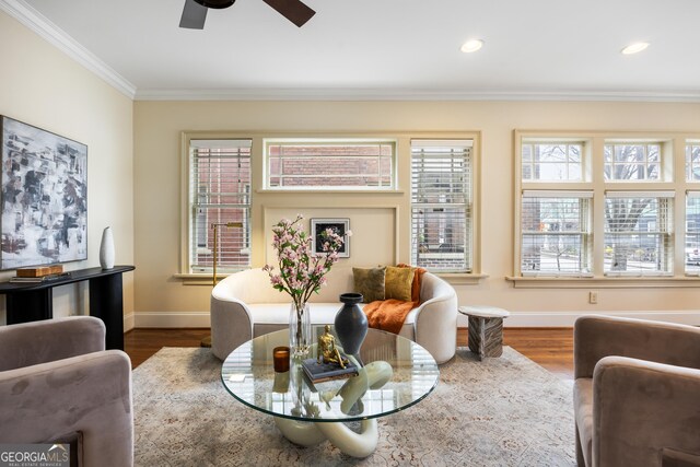 kitchen featuring sink, light stone counters, hardwood / wood-style floors, cream cabinetry, and appliances with stainless steel finishes