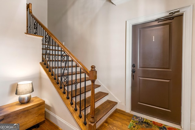 stairway with wood-type flooring