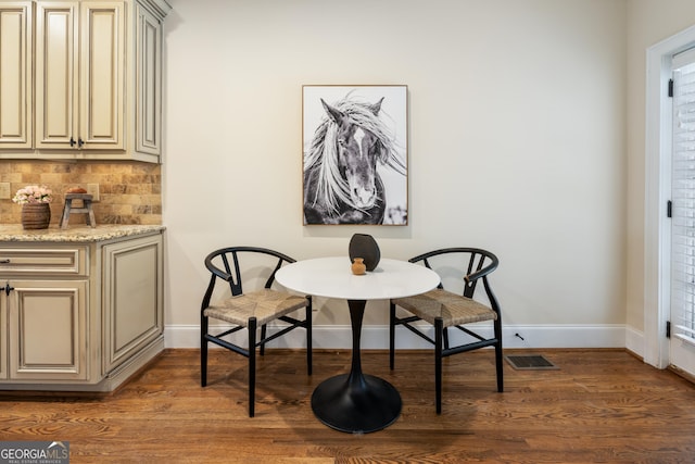 dining area with dark wood-type flooring