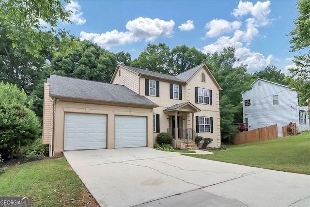 view of front of home featuring a front yard and a garage