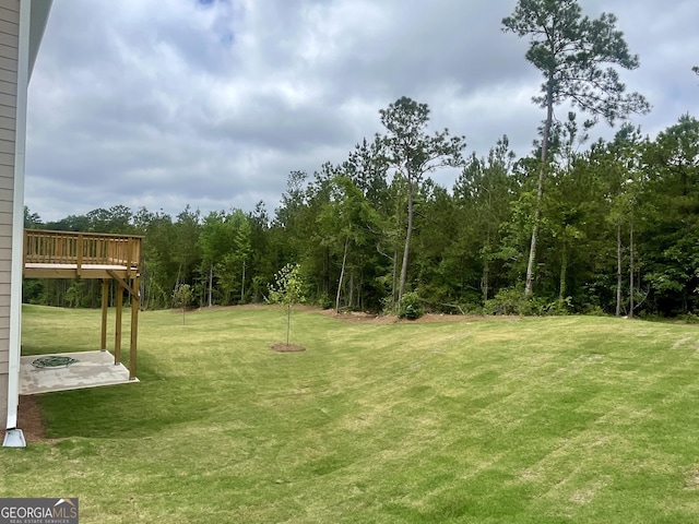 209 Shoreline Way Lot A19, Plan, Macon, GA 31220 - view of green lawn with a deck, a wooded view, and a patio