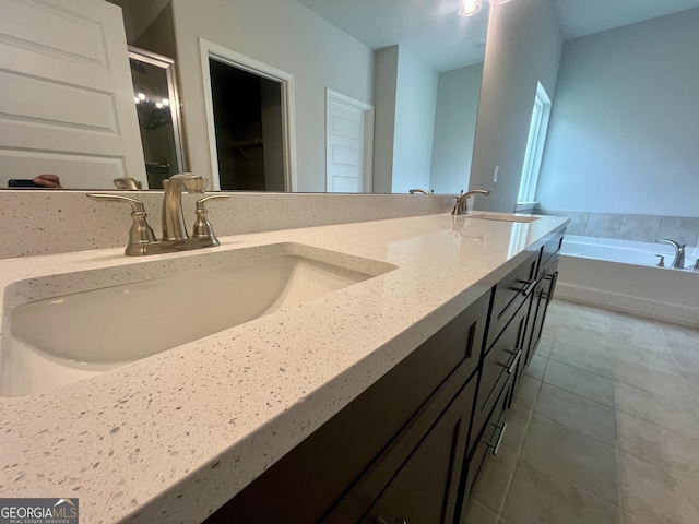 209 Shoreline Way Lot A19, Plan, Macon, GA 31220 - bathroom featuring double vanity, a bath, tile patterned floors, and a stall shower