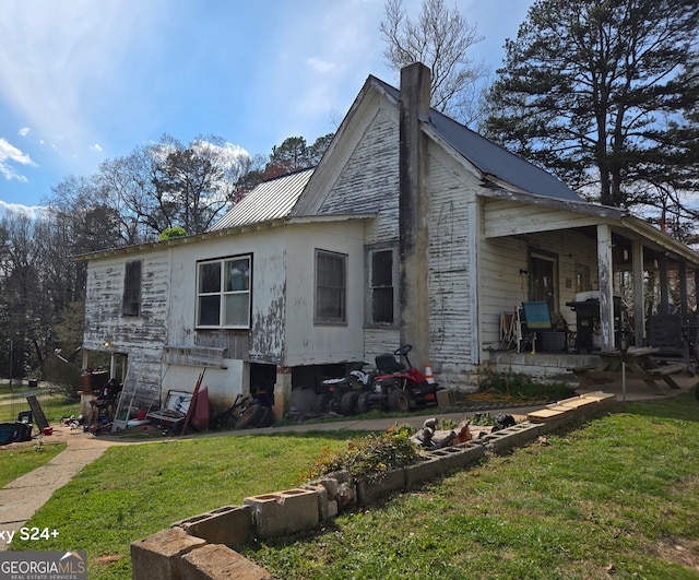 view of property exterior with a yard