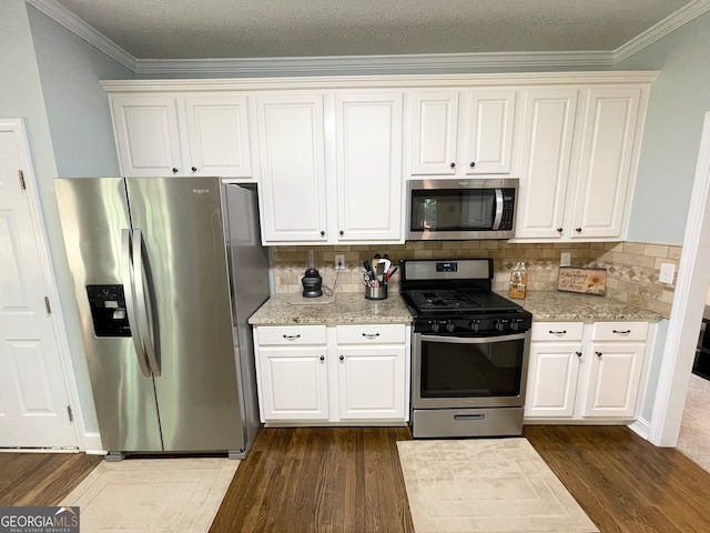 kitchen featuring white cabinets and stainless steel appliances