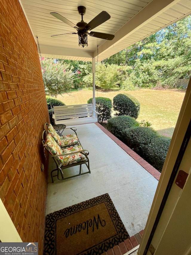 view of patio / terrace with ceiling fan and a porch