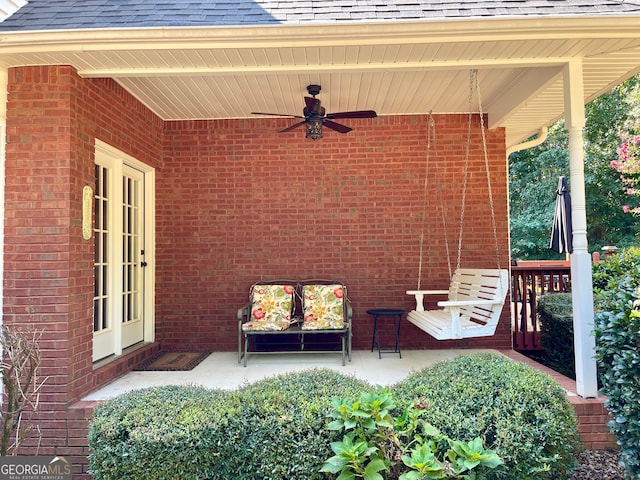 view of patio / terrace featuring ceiling fan and french doors