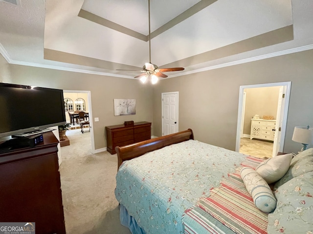 carpeted bedroom with a raised ceiling, ceiling fan, and crown molding