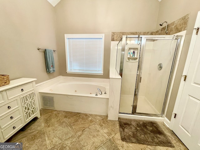 bathroom featuring separate shower and tub