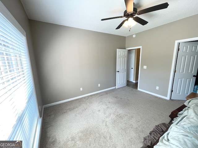 unfurnished bedroom featuring carpet flooring and ceiling fan