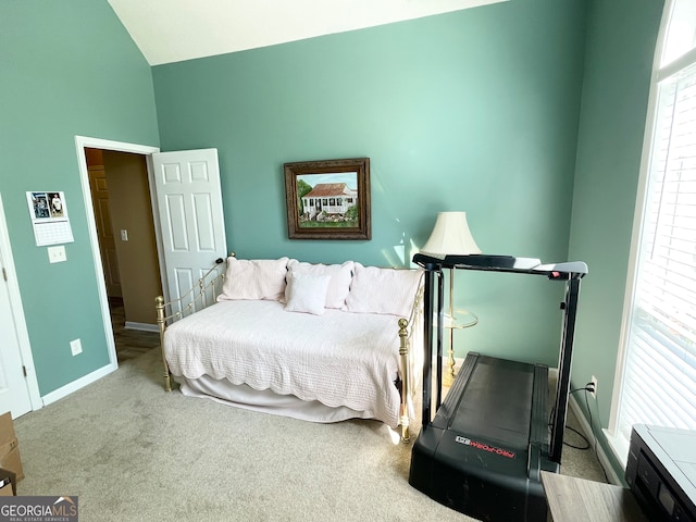 carpeted bedroom with vaulted ceiling