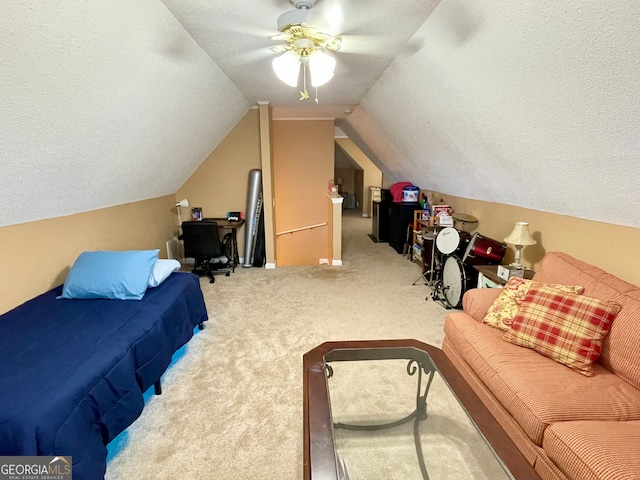 interior space with a textured ceiling, ceiling fan, light carpet, and lofted ceiling