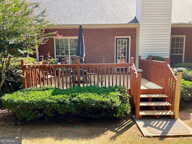 exterior space featuring a wooden deck