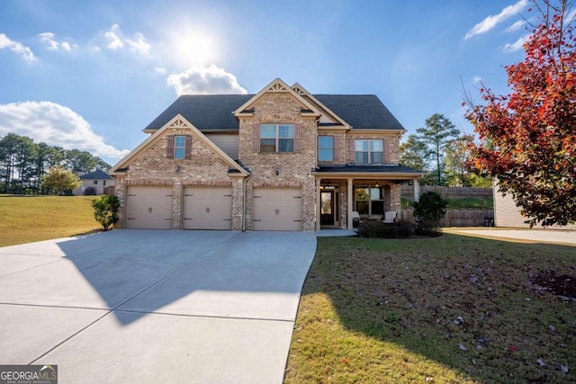 craftsman-style house with a front yard, a porch, and a garage