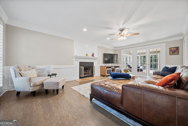 living room with hardwood / wood-style flooring, ceiling fan, crown molding, and french doors