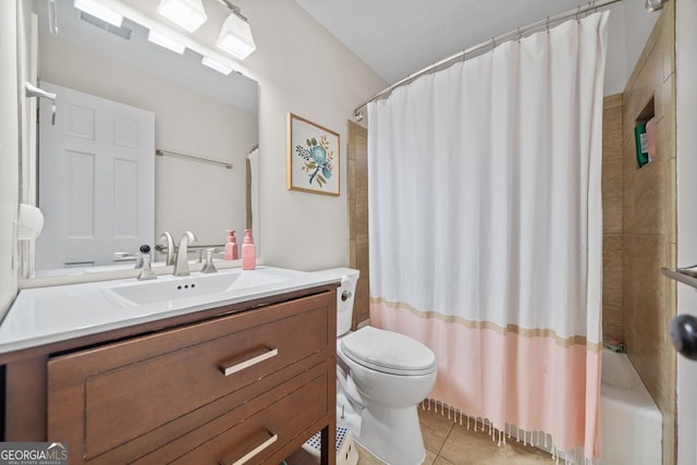 full bathroom featuring tile patterned flooring, vanity, shower / tub combo, and toilet