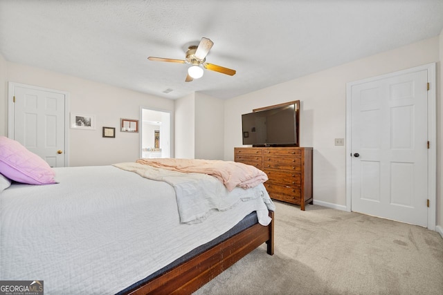 bedroom featuring ceiling fan and light colored carpet