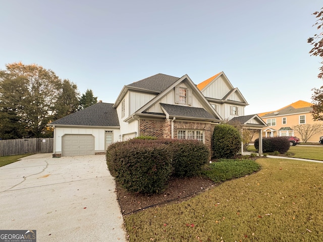 view of front of house featuring a front yard and a garage