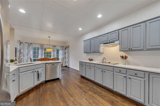 kitchen with gray cabinetry, dark wood-type flooring, gas cooktop, stainless steel dishwasher, and pendant lighting