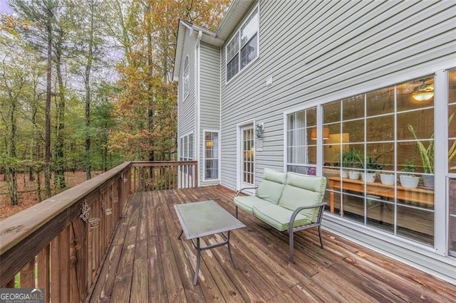 wooden deck with an outdoor hangout area