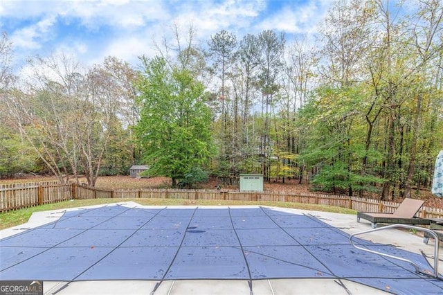 view of swimming pool with a patio