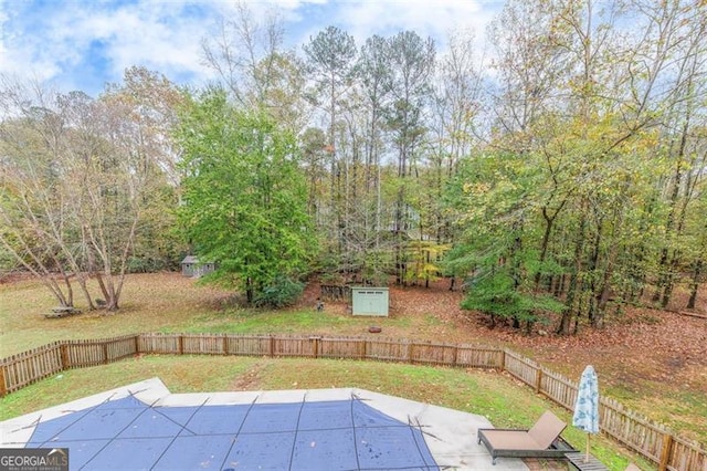 view of swimming pool with a yard and a patio