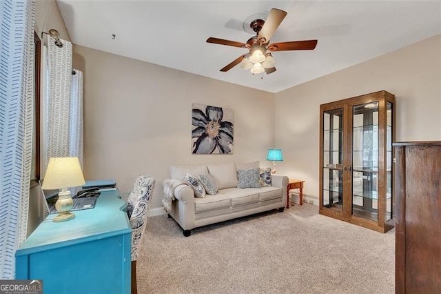 living room featuring ceiling fan and light colored carpet