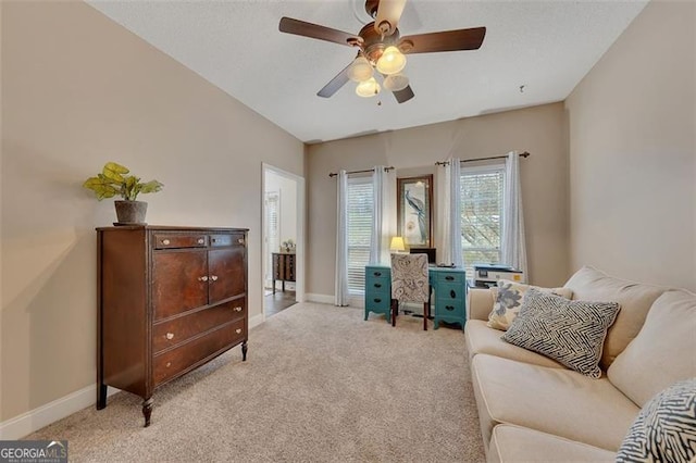 sitting room with light carpet and ceiling fan