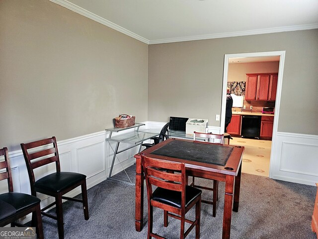 carpeted dining space featuring crown molding