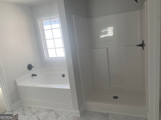 bathroom with shower with separate bathtub