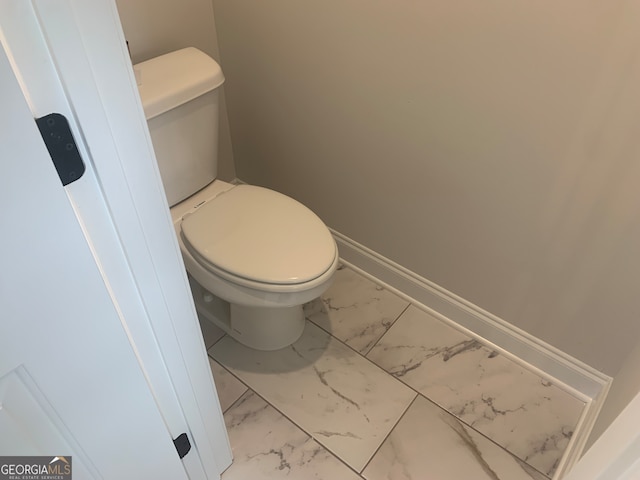 bathroom featuring toilet