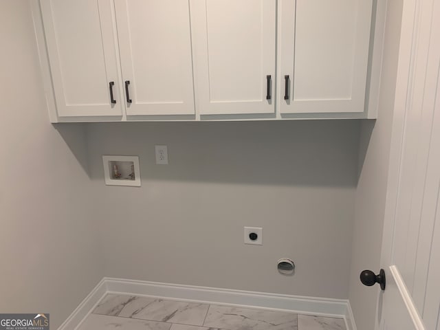 laundry room featuring cabinets, washer hookup, and electric dryer hookup