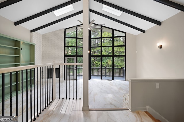 doorway featuring lofted ceiling with skylight