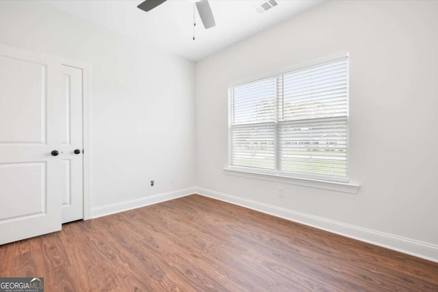 spare room with ceiling fan and hardwood / wood-style floors