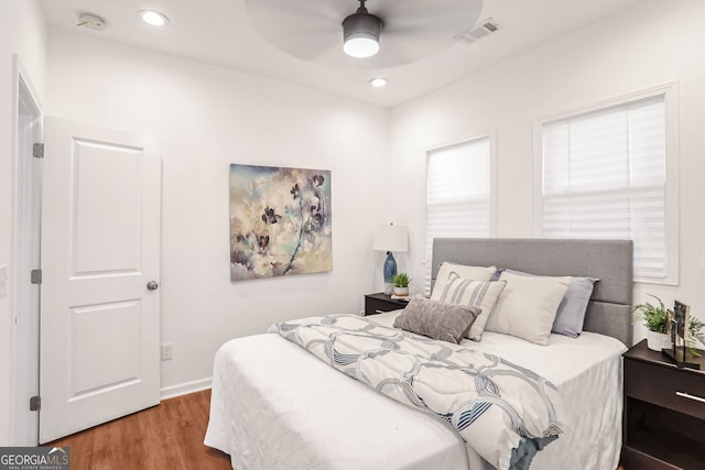 bedroom featuring ceiling fan and hardwood / wood-style floors