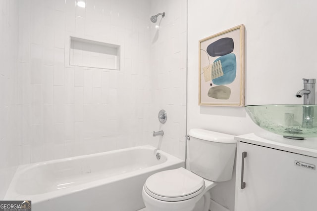 full bathroom featuring vanity, toilet, and tiled shower / bath