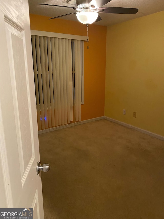 unfurnished room with carpet flooring