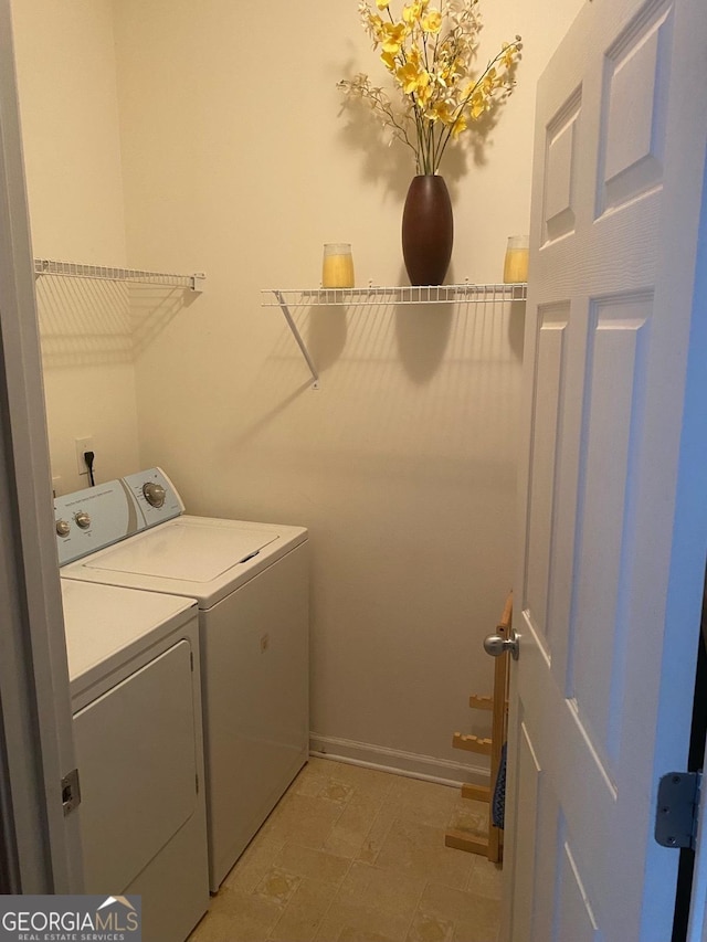 laundry room with washer and dryer