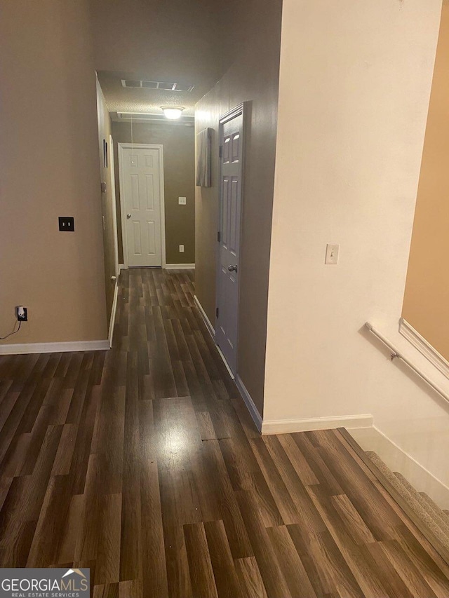 corridor featuring dark hardwood / wood-style flooring