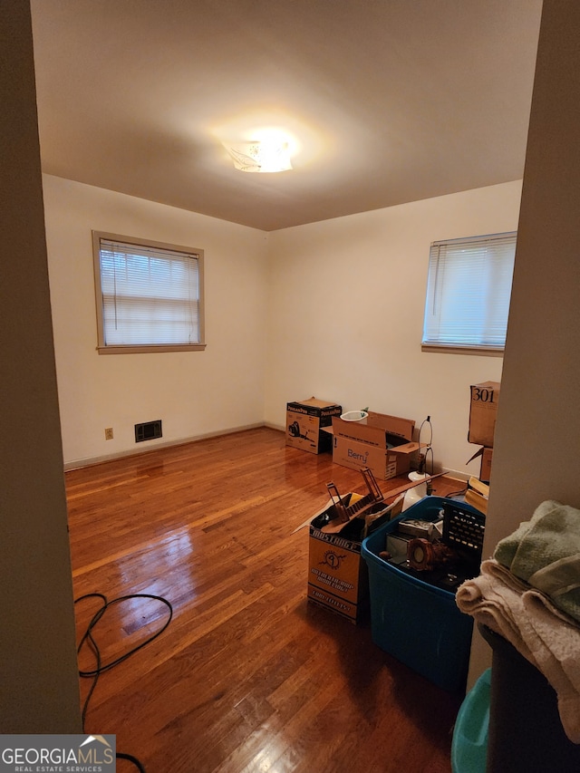 miscellaneous room featuring dark wood-type flooring