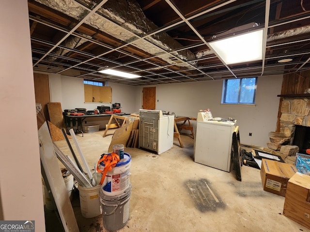 basement featuring a fireplace and independent washer and dryer