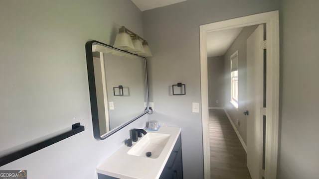 bathroom featuring vanity and wood-type flooring