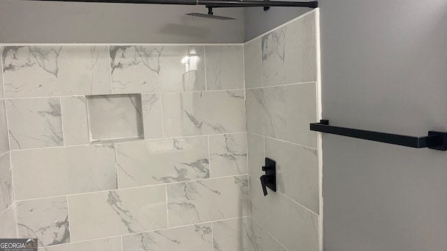 room details with a tile shower