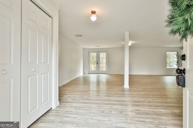 interior space featuring french doors and light hardwood / wood-style flooring