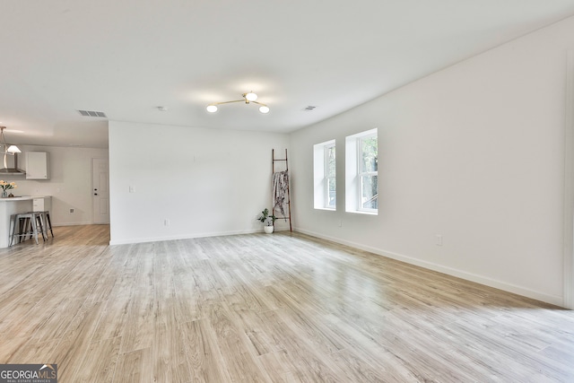 unfurnished room featuring light hardwood / wood-style floors