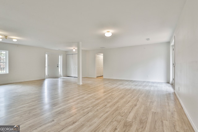 spare room with light hardwood / wood-style flooring