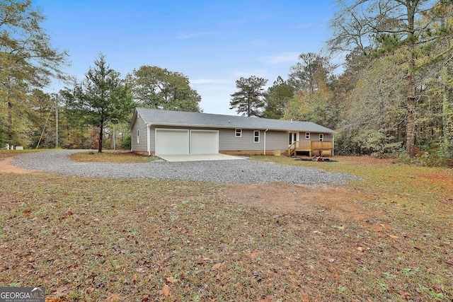 exterior space with a wooden deck and a garage